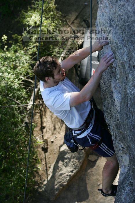 Me top roping Lick the Window (5.10c), shot by Javier Morales from the top of Ack! (5.11b, but using the crack for the start instead) that I top roped up with my camera on my back.  It was another long day of rock climbing at Seismic Wall on Austin's Barton Creek Greenbelt, Sunday, April 5, 2009.

Filename: SRM_20090405_17281220.jpg
Aperture: f/5.0
Shutter Speed: 1/320
Body: Canon EOS-1D Mark II
Lens: Canon EF 80-200mm f/2.8 L