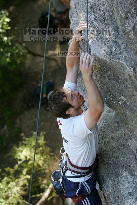 Me top roping Lick the Window (5.10c), shot by Javier Morales from the top of Ack! (5.11b, but using the crack for the start instead) that I top roped up with my camera on my back.  It was another long day of rock climbing at Seismic Wall on Austin's Barton Creek Greenbelt, Sunday, April 5, 2009.

Filename: SRM_20090405_17284536.jpg
Aperture: f/4.0
Shutter Speed: 1/320
Body: Canon EOS-1D Mark II
Lens: Canon EF 80-200mm f/2.8 L