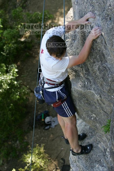 Me top roping Lick the Window (5.10c), shot by Javier Morales from the top of Ack! (5.11b, but using the crack for the start instead) that I top roped up with my camera on my back.  It was another long day of rock climbing at Seismic Wall on Austin's Barton Creek Greenbelt, Sunday, April 5, 2009.

Filename: SRM_20090405_17285947.jpg
Aperture: f/4.5
Shutter Speed: 1/320
Body: Canon EOS-1D Mark II
Lens: Canon EF 80-200mm f/2.8 L