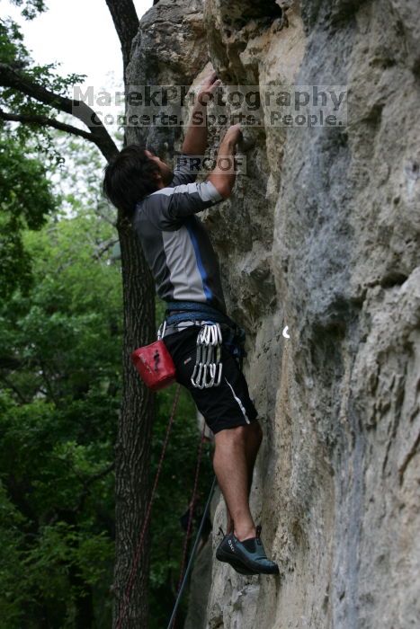 Javier Morales leading up Angel of Poets (5.10a).  It was another long day of rock climbing at Seismic Wall on Austin's Barton Creek Greenbelt, Saturday, April 11, 2009.

Filename: SRM_20090411_12364511.JPG
Aperture: f/5.6
Shutter Speed: 1/250
Body: Canon EOS-1D Mark II
Lens: Canon EF 80-200mm f/2.8 L