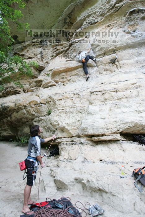 Andrew Dreher lead climbing Magster (5.10a) with Javier Morales belaying.  It was another long day of rock climbing at Seismic Wall on Austin's Barton Creek Greenbelt, Saturday, April 11, 2009.

Filename: SRM_20090411_15315085.JPG
Aperture: f/3.5
Shutter Speed: 1/250
Body: Canon EOS-1D Mark II
Lens: Canon EF 16-35mm f/2.8 L