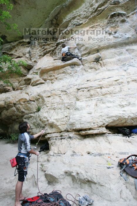 Andrew Dreher lead climbing Magster (5.10a) with Javier Morales belaying.  It was another long day of rock climbing at Seismic Wall on Austin's Barton Creek Greenbelt, Saturday, April 11, 2009.

Filename: SRM_20090411_15320287.JPG
Aperture: f/4.0
Shutter Speed: 1/250
Body: Canon EOS-1D Mark II
Lens: Canon EF 16-35mm f/2.8 L