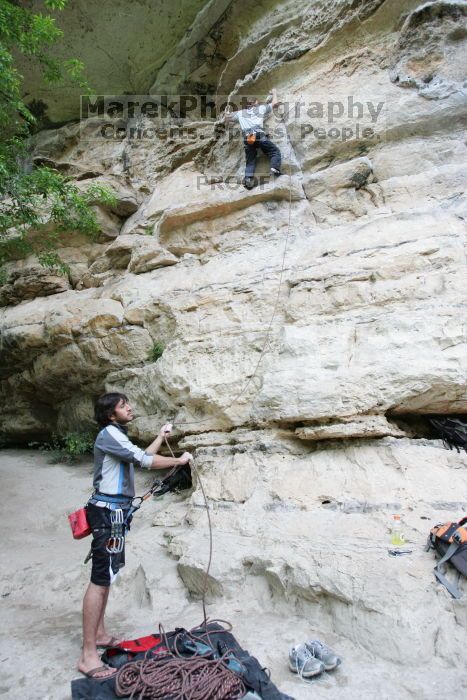 Andrew Dreher lead climbing Magster (5.10a) with Javier Morales belaying.  It was another long day of rock climbing at Seismic Wall on Austin's Barton Creek Greenbelt, Saturday, April 11, 2009.

Filename: SRM_20090411_15321989.JPG
Aperture: f/4.0
Shutter Speed: 1/250
Body: Canon EOS-1D Mark II
Lens: Canon EF 16-35mm f/2.8 L