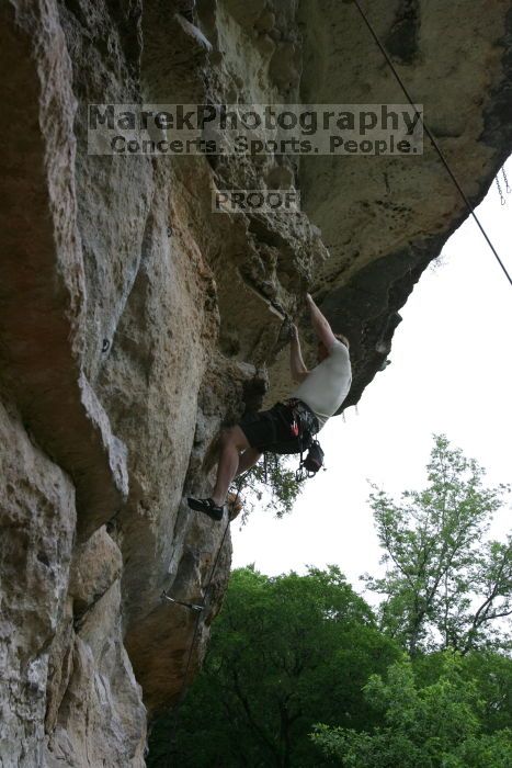 Adam Libson climbing Diving for Rocks (5.10d), shot by Andrew Dreher.  It was another long day of rock climbing at Seismic Wall on Austin's Barton Creek Greenbelt, Saturday, April 11, 2009.

Filename: SRM_20090411_15570435.JPG
Aperture: f/7.1
Shutter Speed: 1/200
Body: Canon EOS-1D Mark II
Lens: Canon EF 16-35mm f/2.8 L