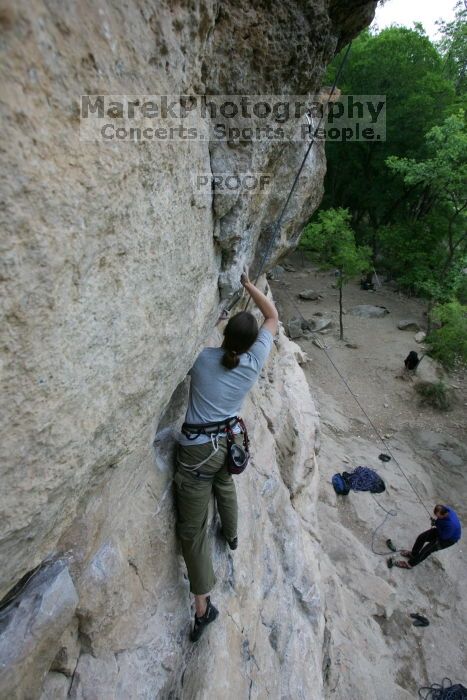 Hannah Norton top rope climbing Diving for Rocks (5.10d), photographed from  the third bolt of Magster (5.10a).  It was another long day of rock climbing at Seismic Wall on Austin's Barton Creek Greenbelt, Saturday, April 11, 2009.

Filename: SRM_20090411_16101041.JPG
Aperture: f/4.5
Shutter Speed: 1/250
Body: Canon EOS-1D Mark II
Lens: Canon EF 16-35mm f/2.8 L