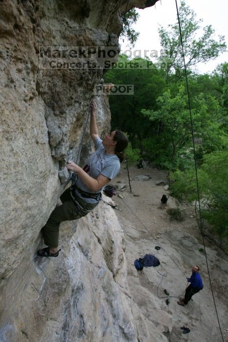 Hannah Norton top rope climbing Diving for Rocks (5.10d), photographed from  the third bolt of Magster (5.10a).  It was another long day of rock climbing at Seismic Wall on Austin's Barton Creek Greenbelt, Saturday, April 11, 2009.

Filename: SRM_20090411_16102844.JPG
Aperture: f/5.0
Shutter Speed: 1/250
Body: Canon EOS-1D Mark II
Lens: Canon EF 16-35mm f/2.8 L