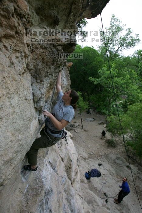 Hannah Norton top rope climbing Diving for Rocks (5.10d), photographed from  the third bolt of Magster (5.10a).  It was another long day of rock climbing at Seismic Wall on Austin's Barton Creek Greenbelt, Saturday, April 11, 2009.

Filename: SRM_20090411_16102846.JPG
Aperture: f/5.0
Shutter Speed: 1/250
Body: Canon EOS-1D Mark II
Lens: Canon EF 16-35mm f/2.8 L