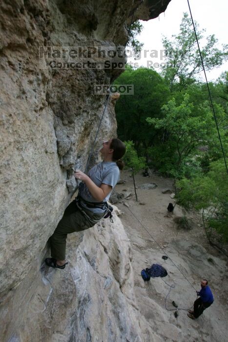 Hannah Norton top rope climbing Diving for Rocks (5.10d), photographed from  the third bolt of Magster (5.10a).  It was another long day of rock climbing at Seismic Wall on Austin's Barton Creek Greenbelt, Saturday, April 11, 2009.

Filename: SRM_20090411_16103049.JPG
Aperture: f/5.0
Shutter Speed: 1/250
Body: Canon EOS-1D Mark II
Lens: Canon EF 16-35mm f/2.8 L