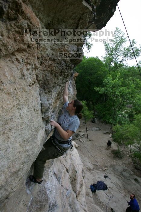 Hannah Norton top rope climbing Diving for Rocks (5.10d), photographed from  the third bolt of Magster (5.10a).  It was another long day of rock climbing at Seismic Wall on Austin's Barton Creek Greenbelt, Saturday, April 11, 2009.

Filename: SRM_20090411_16103151.JPG
Aperture: f/5.0
Shutter Speed: 1/250
Body: Canon EOS-1D Mark II
Lens: Canon EF 16-35mm f/2.8 L