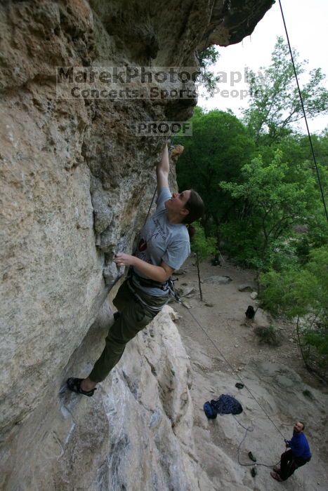 Hannah Norton top rope climbing Diving for Rocks (5.10d), photographed from  the third bolt of Magster (5.10a).  It was another long day of rock climbing at Seismic Wall on Austin's Barton Creek Greenbelt, Saturday, April 11, 2009.

Filename: SRM_20090411_16103454.JPG
Aperture: f/5.0
Shutter Speed: 1/250
Body: Canon EOS-1D Mark II
Lens: Canon EF 16-35mm f/2.8 L