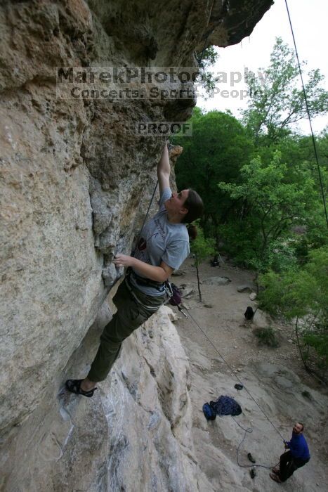 Hannah Norton top rope climbing Diving for Rocks (5.10d), photographed from  the third bolt of Magster (5.10a).  It was another long day of rock climbing at Seismic Wall on Austin's Barton Creek Greenbelt, Saturday, April 11, 2009.

Filename: SRM_20090411_16103555.JPG
Aperture: f/5.0
Shutter Speed: 1/250
Body: Canon EOS-1D Mark II
Lens: Canon EF 16-35mm f/2.8 L