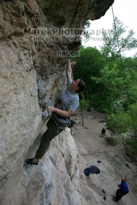 Hannah Norton top rope climbing Diving for Rocks (5.10d), photographed from  the third bolt of Magster (5.10a).  It was another long day of rock climbing at Seismic Wall on Austin's Barton Creek Greenbelt, Saturday, April 11, 2009.

Filename: SRM_20090411_16103556.JPG
Aperture: f/5.0
Shutter Speed: 1/250
Body: Canon EOS-1D Mark II
Lens: Canon EF 16-35mm f/2.8 L