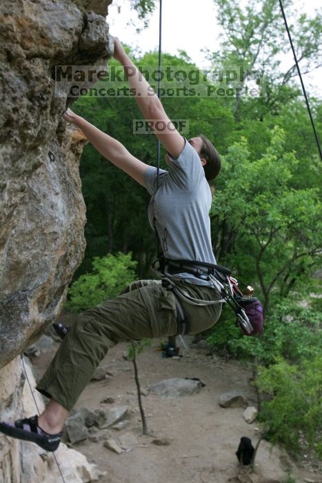 Hannah Norton top rope climbing Diving for Rocks (5.10d), photographed from  the third bolt of Magster (5.10a).  It was another long day of rock climbing at Seismic Wall on Austin's Barton Creek Greenbelt, Saturday, April 11, 2009.

Filename: SRM_20090411_16112361.JPG
Aperture: f/4.0
Shutter Speed: 1/250
Body: Canon EOS-1D Mark II
Lens: Canon EF 16-35mm f/2.8 L