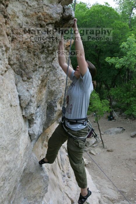 Hannah Norton top rope climbing Diving for Rocks (5.10d), photographed from  the third bolt of Magster (5.10a).  It was another long day of rock climbing at Seismic Wall on Austin's Barton Creek Greenbelt, Saturday, April 11, 2009.

Filename: SRM_20090411_16133666.JPG
Aperture: f/4.0
Shutter Speed: 1/250
Body: Canon EOS-1D Mark II
Lens: Canon EF 16-35mm f/2.8 L