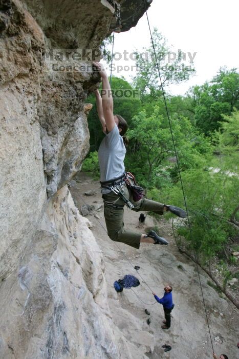 Hannah Norton top rope climbing Diving for Rocks (5.10d), photographed from  the third bolt of Magster (5.10a).  It was another long day of rock climbing at Seismic Wall on Austin's Barton Creek Greenbelt, Saturday, April 11, 2009.

Filename: SRM_20090411_16134168.JPG
Aperture: f/4.0
Shutter Speed: 1/250
Body: Canon EOS-1D Mark II
Lens: Canon EF 16-35mm f/2.8 L