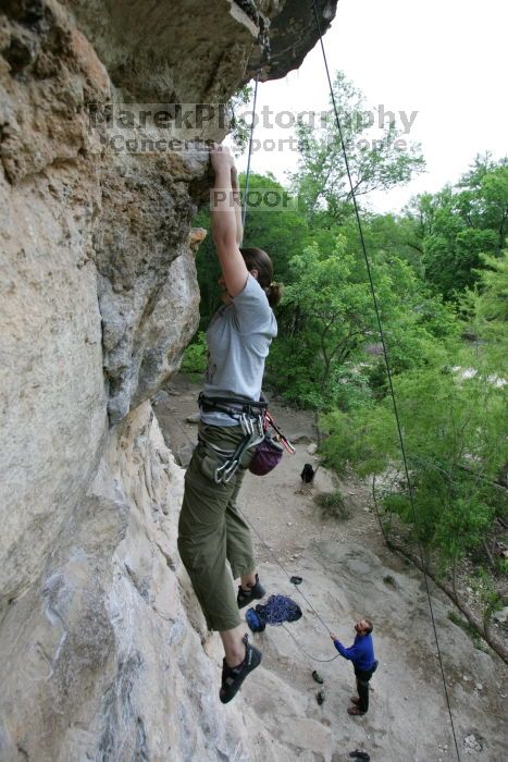 Hannah Norton top rope climbing Diving for Rocks (5.10d), photographed from  the third bolt of Magster (5.10a).  It was another long day of rock climbing at Seismic Wall on Austin's Barton Creek Greenbelt, Saturday, April 11, 2009.

Filename: SRM_20090411_16134375.JPG
Aperture: f/4.0
Shutter Speed: 1/250
Body: Canon EOS-1D Mark II
Lens: Canon EF 16-35mm f/2.8 L