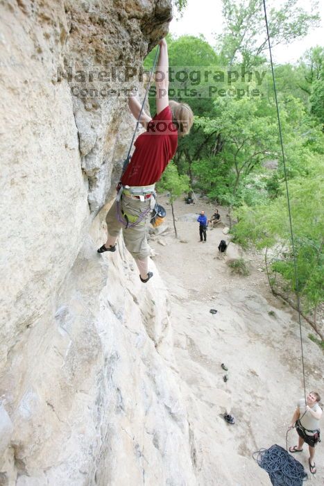 Kirsten Viering top rope climbing Diving for Rocks (5.10d), photographed from  the third bolt of Magster (5.10a).  It was another long day of rock climbing at Seismic Wall on Austin's Barton Creek Greenbelt, Saturday, April 11, 2009.

Filename: SRM_20090411_16191792.JPG
Aperture: f/4.0
Shutter Speed: 1/250
Body: Canon EOS-1D Mark II
Lens: Canon EF 16-35mm f/2.8 L