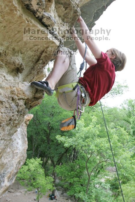 Kirsten Viering top rope climbing Diving for Rocks (5.10d), photographed from  the third bolt of Magster (5.10a).  It was another long day of rock climbing at Seismic Wall on Austin's Barton Creek Greenbelt, Saturday, April 11, 2009.

Filename: SRM_20090411_16194105.JPG
Aperture: f/4.0
Shutter Speed: 1/250
Body: Canon EOS-1D Mark II
Lens: Canon EF 16-35mm f/2.8 L