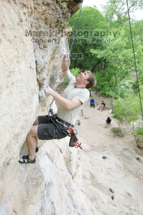 Adam Libson top rope climbing Diving for Rocks (5.10d), photographed from  the third bolt of Magster (5.10a).  It was another long day of rock climbing at Seismic Wall on Austin's Barton Creek Greenbelt, Saturday, April 11, 2009.

Filename: SRM_20090411_16242111.JPG
Aperture: f/4.0
Shutter Speed: 1/250
Body: Canon EOS-1D Mark II
Lens: Canon EF 16-35mm f/2.8 L