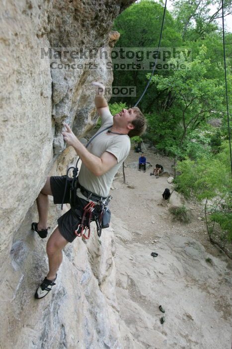 Adam Libson top rope climbing Diving for Rocks (5.10d), photographed from  the third bolt of Magster (5.10a).  It was another long day of rock climbing at Seismic Wall on Austin's Barton Creek Greenbelt, Saturday, April 11, 2009.

Filename: SRM_20090411_16251426.JPG
Aperture: f/5.0
Shutter Speed: 1/400
Body: Canon EOS-1D Mark II
Lens: Canon EF 16-35mm f/2.8 L