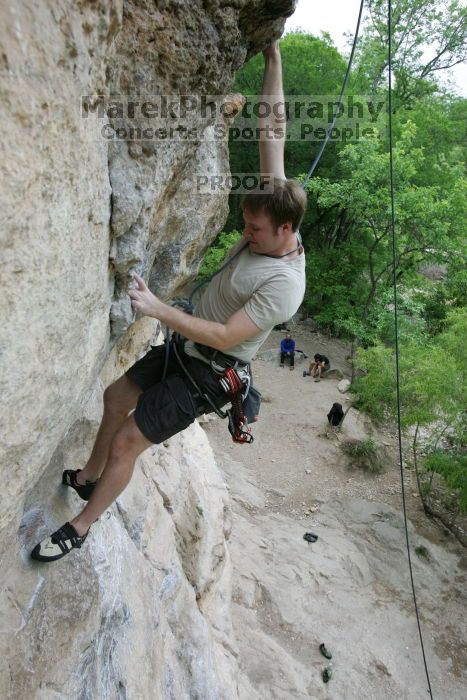 Adam Libson top rope climbing Diving for Rocks (5.10d), photographed from  the third bolt of Magster (5.10a).  It was another long day of rock climbing at Seismic Wall on Austin's Barton Creek Greenbelt, Saturday, April 11, 2009.

Filename: SRM_20090411_16251432.JPG
Aperture: f/5.0
Shutter Speed: 1/400
Body: Canon EOS-1D Mark II
Lens: Canon EF 16-35mm f/2.8 L