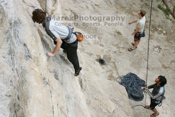 Andrew Dreher top rope climbing Diving for Rocks (5.10d) with Javier Morales belaying, photographed from  the third bolt of Magster (5.10a).  It was another long day of rock climbing at Seismic Wall on Austin's Barton Creek Greenbelt, Saturday, April 11, 2009.

Filename: SRM_20090411_16411070.JPG
Aperture: f/5.6
Shutter Speed: 1/320
Body: Canon EOS-1D Mark II
Lens: Canon EF 16-35mm f/2.8 L