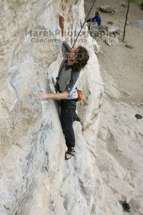 Andrew Dreher top rope climbing Diving for Rocks (5.10d), photographed from  the third bolt of Magster (5.10a).  It was another long day of rock climbing at Seismic Wall on Austin's Barton Creek Greenbelt, Saturday, April 11, 2009.

Filename: SRM_20090411_16412972.JPG
Aperture: f/5.6
Shutter Speed: 1/320
Body: Canon EOS-1D Mark II
Lens: Canon EF 16-35mm f/2.8 L