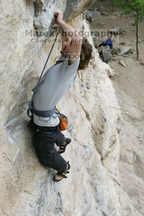 Andrew Dreher top rope climbing Diving for Rocks (5.10d), photographed from  the third bolt of Magster (5.10a).  It was another long day of rock climbing at Seismic Wall on Austin's Barton Creek Greenbelt, Saturday, April 11, 2009.

Filename: SRM_20090411_16415978.JPG
Aperture: f/5.6
Shutter Speed: 1/320
Body: Canon EOS-1D Mark II
Lens: Canon EF 16-35mm f/2.8 L