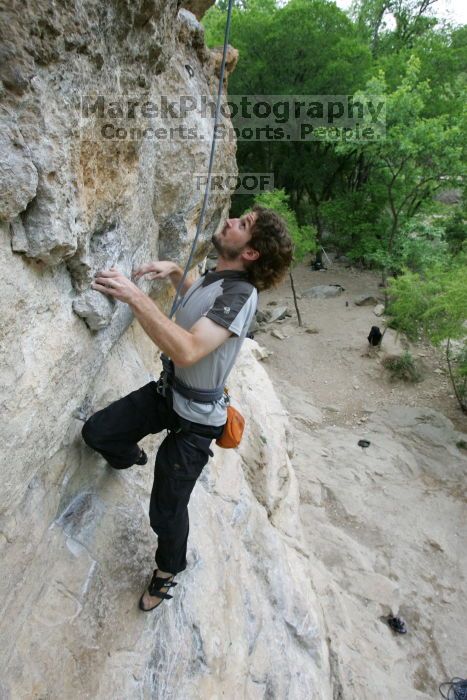 Andrew Dreher top rope climbing Diving for Rocks (5.10d), photographed from  the third bolt of Magster (5.10a).  It was another long day of rock climbing at Seismic Wall on Austin's Barton Creek Greenbelt, Saturday, April 11, 2009.

Filename: SRM_20090411_16423891.JPG
Aperture: f/5.6
Shutter Speed: 1/320
Body: Canon EOS-1D Mark II
Lens: Canon EF 16-35mm f/2.8 L