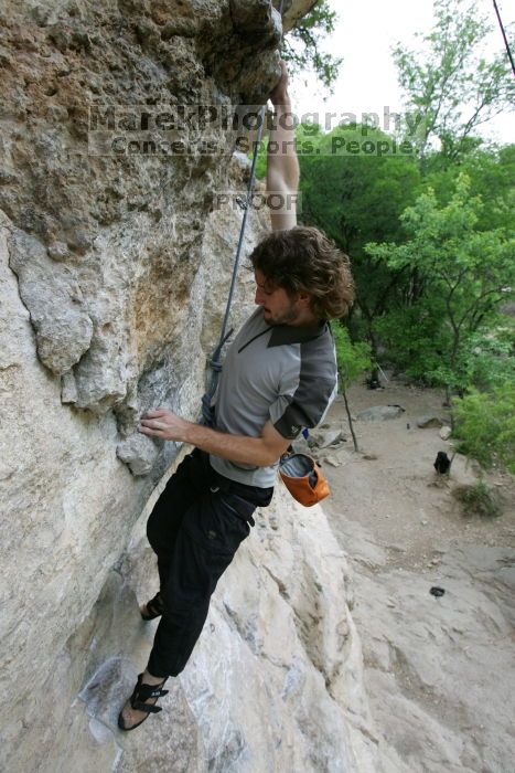 Andrew Dreher top rope climbing Diving for Rocks (5.10d), photographed from  the third bolt of Magster (5.10a).  It was another long day of rock climbing at Seismic Wall on Austin's Barton Creek Greenbelt, Saturday, April 11, 2009.

Filename: SRM_20090411_16423900.JPG
Aperture: f/5.6
Shutter Speed: 1/320
Body: Canon EOS-1D Mark II
Lens: Canon EF 16-35mm f/2.8 L