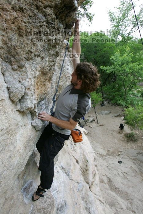 Andrew Dreher top rope climbing Diving for Rocks (5.10d), photographed from  the third bolt of Magster (5.10a).  It was another long day of rock climbing at Seismic Wall on Austin's Barton Creek Greenbelt, Saturday, April 11, 2009.

Filename: SRM_20090411_16423997.JPG
Aperture: f/5.6
Shutter Speed: 1/320
Body: Canon EOS-1D Mark II
Lens: Canon EF 16-35mm f/2.8 L