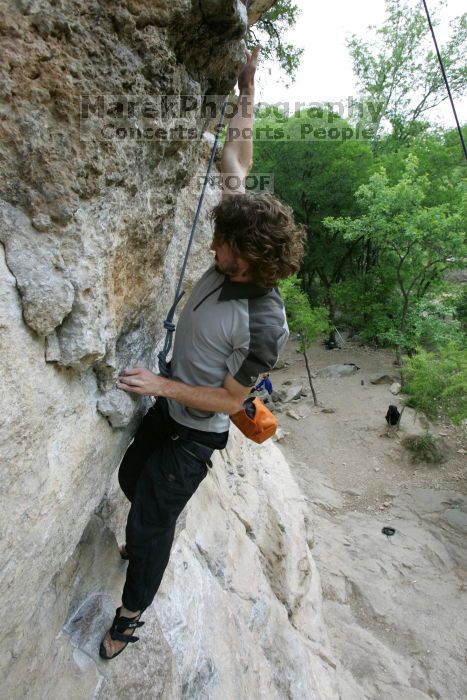 Andrew Dreher top rope climbing Diving for Rocks (5.10d), photographed from  the third bolt of Magster (5.10a).  It was another long day of rock climbing at Seismic Wall on Austin's Barton Creek Greenbelt, Saturday, April 11, 2009.

Filename: SRM_20090411_16423998.JPG
Aperture: f/5.6
Shutter Speed: 1/320
Body: Canon EOS-1D Mark II
Lens: Canon EF 16-35mm f/2.8 L