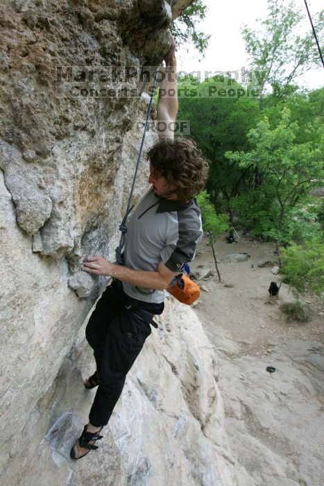 Andrew Dreher top rope climbing Diving for Rocks (5.10d), photographed from  the third bolt of Magster (5.10a).  It was another long day of rock climbing at Seismic Wall on Austin's Barton Creek Greenbelt, Saturday, April 11, 2009.

Filename: SRM_20090411_16423999.JPG
Aperture: f/5.6
Shutter Speed: 1/320
Body: Canon EOS-1D Mark II
Lens: Canon EF 16-35mm f/2.8 L