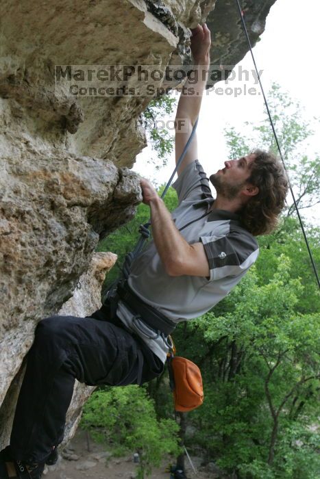 Andrew Dreher top rope climbing Diving for Rocks (5.10d), photographed from  the third bolt of Magster (5.10a).  It was another long day of rock climbing at Seismic Wall on Austin's Barton Creek Greenbelt, Saturday, April 11, 2009.

Filename: SRM_20090411_16424904.JPG
Aperture: f/5.6
Shutter Speed: 1/320
Body: Canon EOS-1D Mark II
Lens: Canon EF 16-35mm f/2.8 L