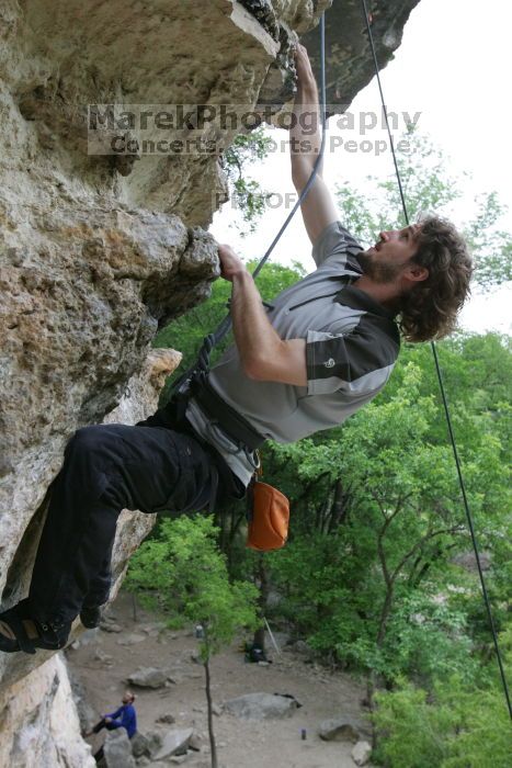 Andrew Dreher top rope climbing Diving for Rocks (5.10d), photographed from  the third bolt of Magster (5.10a).  It was another long day of rock climbing at Seismic Wall on Austin's Barton Creek Greenbelt, Saturday, April 11, 2009.

Filename: SRM_20090411_16425305.JPG
Aperture: f/5.6
Shutter Speed: 1/320
Body: Canon EOS-1D Mark II
Lens: Canon EF 16-35mm f/2.8 L