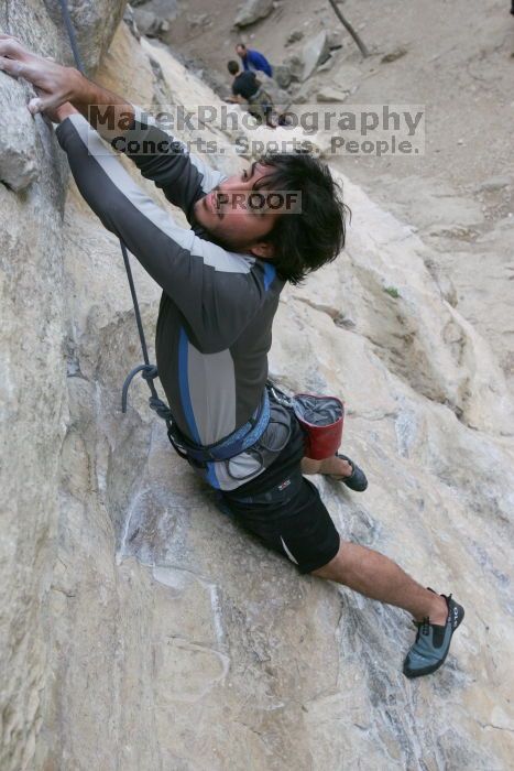 Javier Morales top rope climbing Diving for Rocks (5.10d), photographed from  the third bolt of Magster (5.10a).  It was another long day of rock climbing at Seismic Wall on Austin's Barton Creek Greenbelt, Saturday, April 11, 2009.

Filename: SRM_20090411_16483022.JPG
Aperture: f/5.6
Shutter Speed: 1/320
Body: Canon EOS-1D Mark II
Lens: Canon EF 16-35mm f/2.8 L