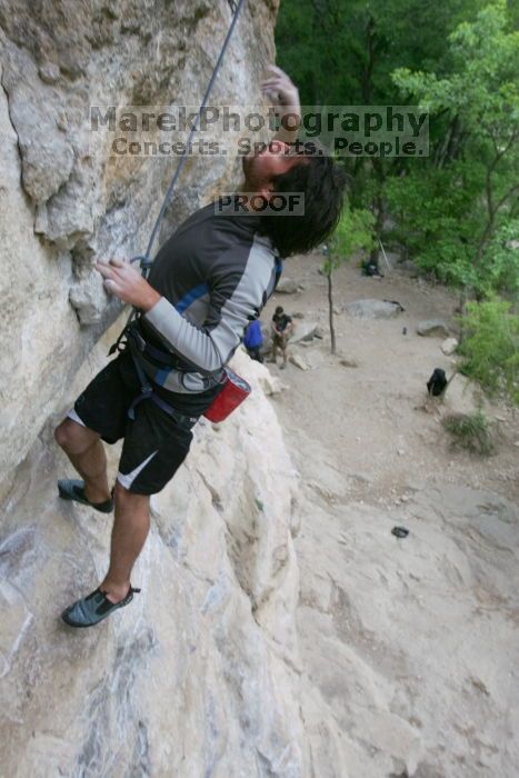 Javier Morales top rope climbing Diving for Rocks (5.10d), photographed from  the third bolt of Magster (5.10a).  It was another long day of rock climbing at Seismic Wall on Austin's Barton Creek Greenbelt, Saturday, April 11, 2009.

Filename: SRM_20090411_16491446.JPG
Aperture: f/5.6
Shutter Speed: 1/320
Body: Canon EOS-1D Mark II
Lens: Canon EF 16-35mm f/2.8 L