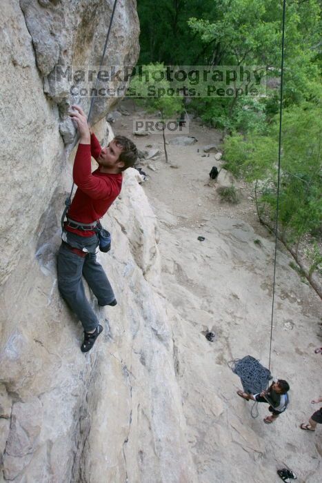 Me top rope climbing Diving for Rocks (5.10d) with Javier Morales belaying, photographed from  the third bolt of Magster (5.10a) by Andrew Dreher.  It was another long day of rock climbing at Seismic Wall on Austin's Barton Creek Greenbelt, Saturday, April 11, 2009.

Filename: SRM_20090411_17044287.JPG
Aperture: f/5.6
Shutter Speed: 1/320
Body: Canon EOS-1D Mark II
Lens: Canon EF 16-35mm f/2.8 L