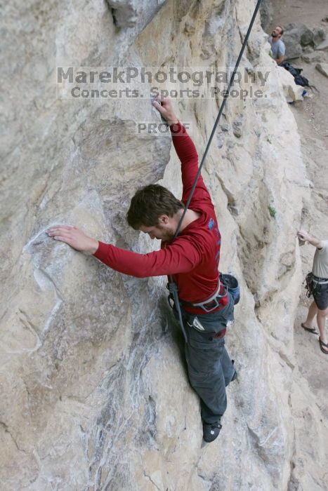 Me top rope climbing Diving for Rocks (5.10d), photographed from  the third bolt of Magster (5.10a) by Andrew Dreher.  It was another long day of rock climbing at Seismic Wall on Austin's Barton Creek Greenbelt, Saturday, April 11, 2009.

Filename: SRM_20090411_17071511.JPG
Aperture: f/5.6
Shutter Speed: 1/320
Body: Canon EOS-1D Mark II
Lens: Canon EF 16-35mm f/2.8 L