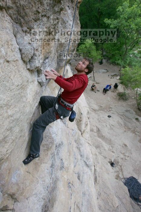 Me top rope climbing Diving for Rocks (5.10d), photographed from  the third bolt of Magster (5.10a) by Andrew Dreher.  It was another long day of rock climbing at Seismic Wall on Austin's Barton Creek Greenbelt, Saturday, April 11, 2009.

Filename: SRM_20090411_17103658.JPG
Aperture: f/5.6
Shutter Speed: 1/320
Body: Canon EOS-1D Mark II
Lens: Canon EF 16-35mm f/2.8 L