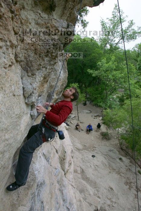 Me top rope climbing Diving for Rocks (5.10d), photographed from  the third bolt of Magster (5.10a) by Andrew Dreher.  It was another long day of rock climbing at Seismic Wall on Austin's Barton Creek Greenbelt, Saturday, April 11, 2009.

Filename: SRM_20090411_17125886.JPG
Aperture: f/5.6
Shutter Speed: 1/320
Body: Canon EOS-1D Mark II
Lens: Canon EF 16-35mm f/2.8 L