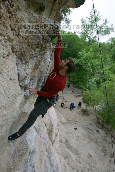 Me top rope climbing Diving for Rocks (5.10d), photographed from  the third bolt of Magster (5.10a) by Andrew Dreher.  It was another long day of rock climbing at Seismic Wall on Austin's Barton Creek Greenbelt, Saturday, April 11, 2009.

Filename: SRM_20090411_17125890.JPG
Aperture: f/5.6
Shutter Speed: 1/320
Body: Canon EOS-1D Mark II
Lens: Canon EF 16-35mm f/2.8 L