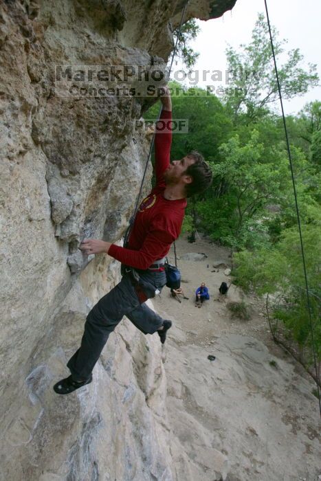 Me top rope climbing Diving for Rocks (5.10d), photographed from  the third bolt of Magster (5.10a) by Andrew Dreher.  It was another long day of rock climbing at Seismic Wall on Austin's Barton Creek Greenbelt, Saturday, April 11, 2009.

Filename: SRM_20090411_17125891.JPG
Aperture: f/5.6
Shutter Speed: 1/320
Body: Canon EOS-1D Mark II
Lens: Canon EF 16-35mm f/2.8 L