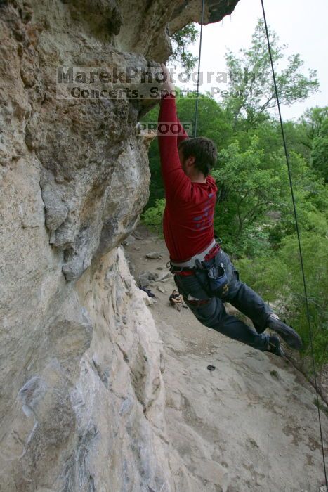 Me top rope climbing Diving for Rocks (5.10d), photographed from  the third bolt of Magster (5.10a) by Andrew Dreher.  It was another long day of rock climbing at Seismic Wall on Austin's Barton Creek Greenbelt, Saturday, April 11, 2009.

Filename: SRM_20090411_17125995.JPG
Aperture: f/5.6
Shutter Speed: 1/320
Body: Canon EOS-1D Mark II
Lens: Canon EF 16-35mm f/2.8 L