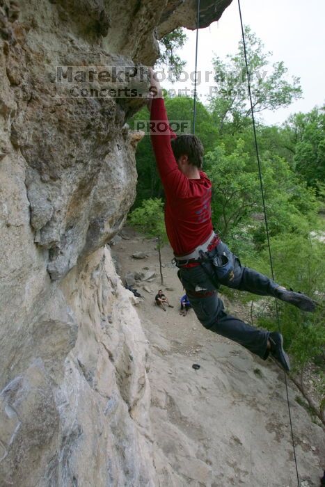 Me top rope climbing Diving for Rocks (5.10d), photographed from  the third bolt of Magster (5.10a) by Andrew Dreher.  It was another long day of rock climbing at Seismic Wall on Austin's Barton Creek Greenbelt, Saturday, April 11, 2009.

Filename: SRM_20090411_17125997.JPG
Aperture: f/5.6
Shutter Speed: 1/320
Body: Canon EOS-1D Mark II
Lens: Canon EF 16-35mm f/2.8 L