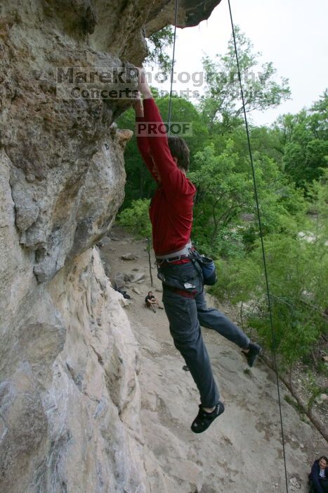 Me top rope climbing Diving for Rocks (5.10d), photographed from  the third bolt of Magster (5.10a) by Andrew Dreher.  It was another long day of rock climbing at Seismic Wall on Austin's Barton Creek Greenbelt, Saturday, April 11, 2009.

Filename: SRM_20090411_17130000.JPG
Aperture: f/5.6
Shutter Speed: 1/320
Body: Canon EOS-1D Mark II
Lens: Canon EF 16-35mm f/2.8 L