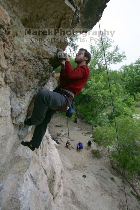 Me top rope climbing Diving for Rocks (5.10d), photographed from  the third bolt of Magster (5.10a) by Andrew Dreher.  It was another long day of rock climbing at Seismic Wall on Austin's Barton Creek Greenbelt, Saturday, April 11, 2009.

Filename: SRM_20090411_17130510.JPG
Aperture: f/5.6
Shutter Speed: 1/320
Body: Canon EOS-1D Mark II
Lens: Canon EF 16-35mm f/2.8 L