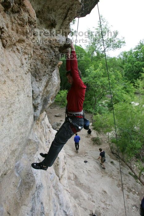 Me top rope climbing Diving for Rocks (5.10d), photographed from  the third bolt of Magster (5.10a) by Andrew Dreher.  It was another long day of rock climbing at Seismic Wall on Austin's Barton Creek Greenbelt, Saturday, April 11, 2009.

Filename: SRM_20090411_17165250.JPG
Aperture: f/5.6
Shutter Speed: 1/320
Body: Canon EOS-1D Mark II
Lens: Canon EF 16-35mm f/2.8 L