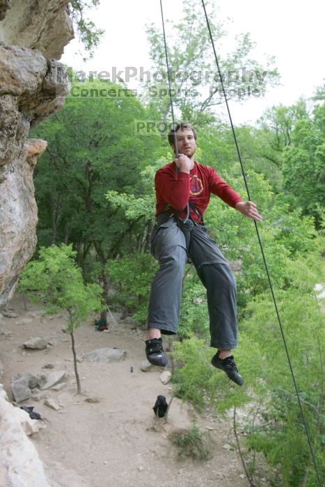 Me top rope climbing Diving for Rocks (5.10d), photographed from  the third bolt of Magster (5.10a) by Andrew Dreher.  It was another long day of rock climbing at Seismic Wall on Austin's Barton Creek Greenbelt, Saturday, April 11, 2009.

Filename: SRM_20090411_17173673.JPG
Aperture: f/5.6
Shutter Speed: 1/320
Body: Canon EOS-1D Mark II
Lens: Canon EF 16-35mm f/2.8 L