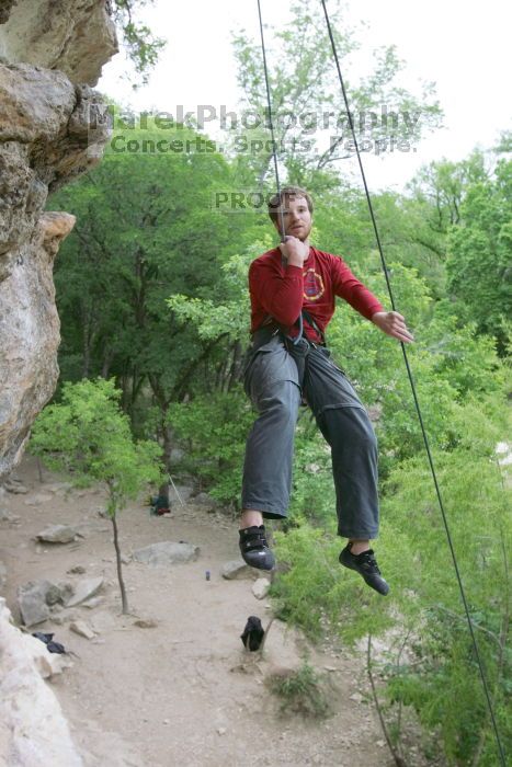 Me top rope climbing Diving for Rocks (5.10d), photographed from  the third bolt of Magster (5.10a) by Andrew Dreher.  It was another long day of rock climbing at Seismic Wall on Austin's Barton Creek Greenbelt, Saturday, April 11, 2009.

Filename: SRM_20090411_17173674.JPG
Aperture: f/5.6
Shutter Speed: 1/320
Body: Canon EOS-1D Mark II
Lens: Canon EF 16-35mm f/2.8 L